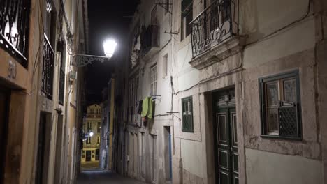 Old-and-typical-street-with-balconies-and-lantern-at-night