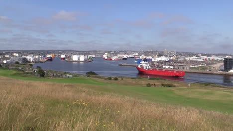 Aberdeen-Harbour-ship-entering-distant-shot-Aberdeen-city-in-background