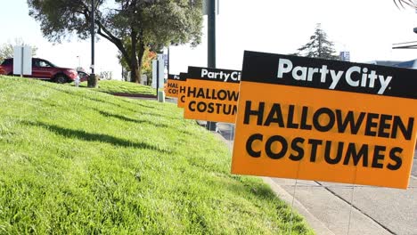 Party-City-Retail-Halloween-Costume-Signs-in-Lawn