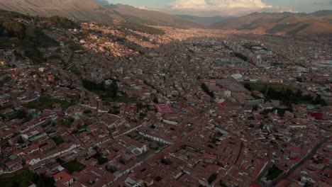 4k-aerial-drone-panoramic-view-during-the-daytime,-before-sunset-of-the-central-Cusco,-capital-of-the-Inca,-with-a-zoom-in-over-the-Plaza-de-Armas