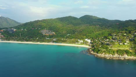 Aerial-panorama-of-tropical-resort-territory-and-beach,-beautiful-Andaman-sea-at-west-coast-of-Phuket-Island
