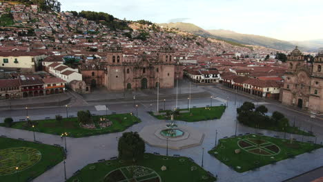 4k-aerial-footage-at-twilight-of-Plaza-de-Armas-in-Cusco-City,-Peru-during-Coronavirus-quarantine,-left-to-right-truck-and-pan,-wide-angle-shot