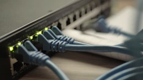 Network-engineer-working-on-Ethernet-cable-switch