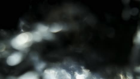 Super-slow-motion-clear-still-water-being-poured-into-a-clear-glass