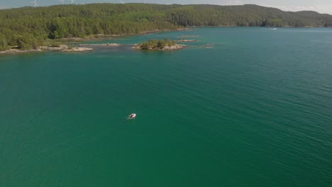 Drone-following-a-small-boat-in-sea