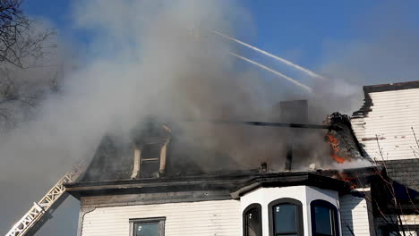 Firefighters-Spraying-Water-from-a-High-Ladder-Over-a-Historic-Victorian-House-Fire-in-Connecticut