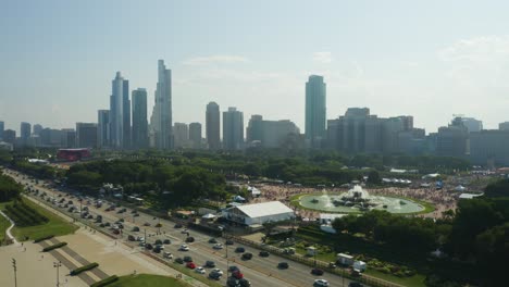 Aerial-Crane-Shot-to-Reveal-Crowds-during-Lollapalooza-in-Chicago,-Illinois---Commercial-Use