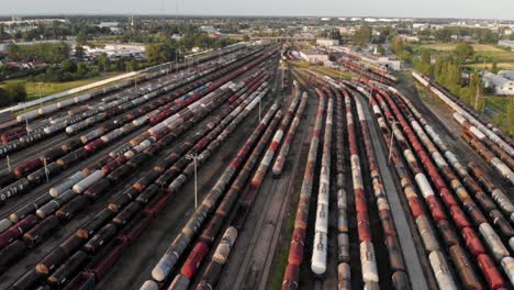 Aerial-shot-Showing-Large-Train-Depot-With-Many-colorful-cargo-Trains
