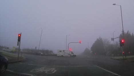 POV-dashboard-driving-in-British-fog-weather-urban-road-traffic