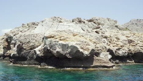 Rocky-coastline-of-mediterranean-sea-with-crystal-clear-water-on-sunny-day