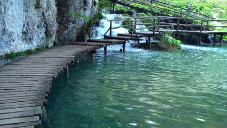 A-completely-empty-wooden-walkway-near-several-waterfalls-at-Plitvice-Lakes-National-Park-in-Croatia,-Europe