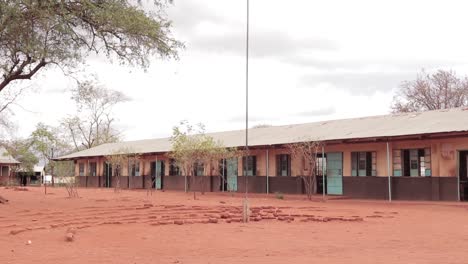 Slider-shot-of-a-school-in-the-rural-Africa-in-a-semi-arid-area,-Kenya-Africa