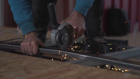 Cutting-steel-with-angle-grinder-slow-motion-sparks-TRACKING-IN-SHOT