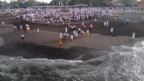 Aerial-over-traditional-purification-ritual-in-Bali,-Indonesia