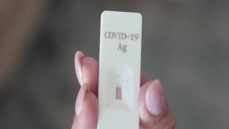 Hand-Holding-Antigen-Rapid-Test-Cassette-Kit-And-Waiting-For-Result-For-COVID-19-Testing