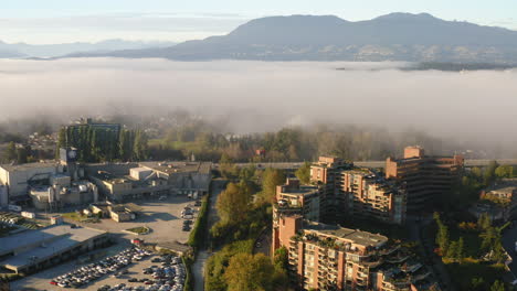Aerial-view-over-Vancouver-on-a-foggy,-summer-morning