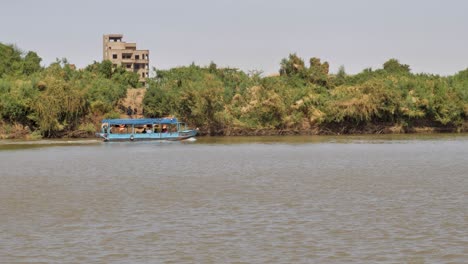 A-boat-on-the-Nile-River-near-Khartoum-in-Sudan---follow-shot