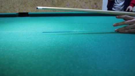 Pool-stick-hiting-the-ball