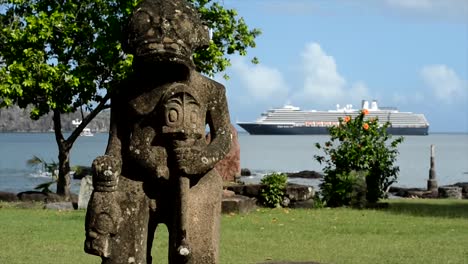 Holland-America-Line-Cruise-ship-in-Taiohae-Bay,-Tiki-statue,-Nuku-Hiva,-Marquesas-Islands,-French-Polynesia