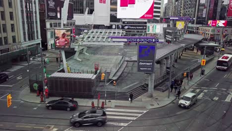 Wide-Aerial-Reveal-of-Public-Square-and-Busy-Street,-Downtown-Toronto-Yonge-Dundas