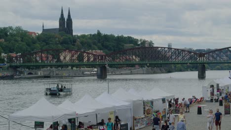 People-enjoying-the-farmer's-market-by-the-Vltava-river-and-Vysehrad-in-amidst-covid-lockdown