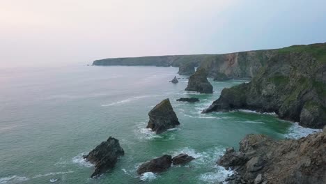 Rocky-mountain-shoreline-of-Bedruthan-Steps-in-England--aerial