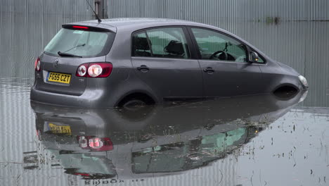 An-abandoned-car-sits-submerged-in-floodwater-with-indicators-flashing-following-thunderstorms-that-saw-more-than-a-month’s-worth-of-torrential-rain-fall-in-several-hours-across-the-capital