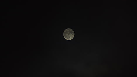 Wide-shot-of-a-full-moon-as-fog-passes-by-revealing-full-moon-at-the-end