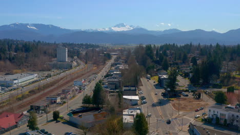 Flying-Above-a-Scenic-Mountain-Town-near-Mt-Baker-as-Cars-Pass-on-the-Streets-Below