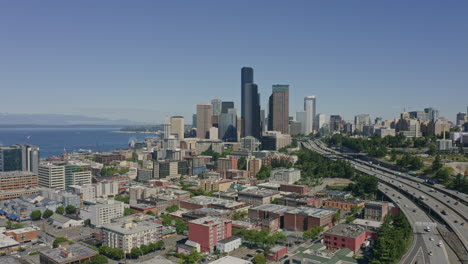 Seattle-Washington-Aerial-v116-panning-shot-of-highway,-Elliot-Bay,-and-high-rise-downtown---June-2020