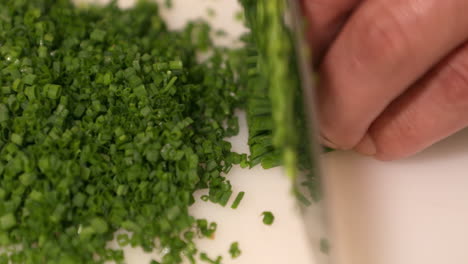 Hands-Chopping-Fresh-Chives-In-Slow-Motion---Sushi-Ingredients---close-up