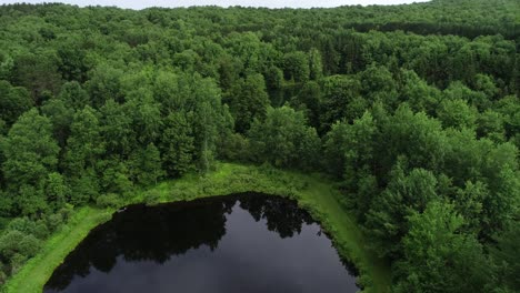 A-drone-flight-over-a-cute-private-bass-pond-in-the-Catskill-Mountains-New-York