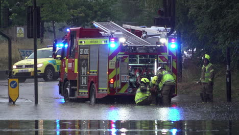 Firefighters-prepare-a-fire-engine-to-pump-water-out-from-a-flooded-road-following-thunderstorms-that-saw-more-than-a-month’s-worth-of-torrential-rain-fall-in-several-hours-across-the-capital