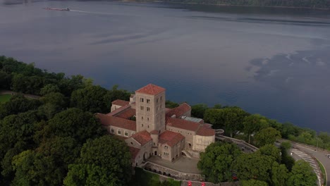 Downward-facing-counterclockwise-aerial-orbit-of-The-Cloisters-on-the-bank-of-the-Hudson-River-in-Upper-Manhattan-NYC