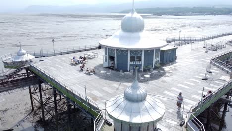 Bangor-Garth-pier-Victorian-ornamental-silver-dome-pavilion-landmark-tourist-aerial-close-right-orbit-view