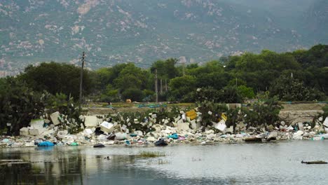 View-Of-Trash-Pollution-On-Edge-Of-Riverbank-At-Son-Hai-In-Vietnam
