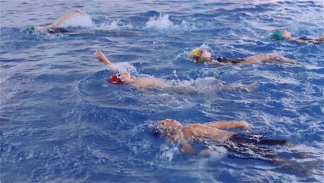 Children-Practicing-Backstroke-In-The-Swimming-Pool-For-Their-Swimming-Lesson---close-up