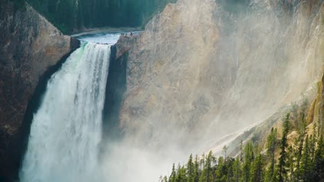 The-Grand-Canyon-of-Yellowstone-National-Park-Lower-Falls-mist-rises-into-the-canyon-in-a-medium-closeup