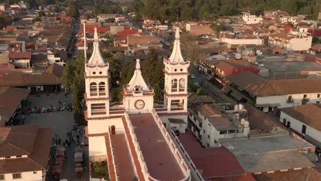 Aerial-View-Of-Parroquia-de-San-Cristobal,-San-Cristobal-Parish-Church-At-Sunset-In-Downtown-of-Mazamitla,-Jalisco,-Mexico