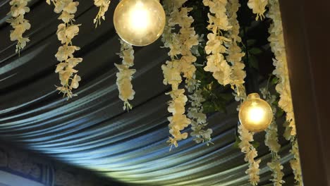 Hanging-Flower-Decorations-With-Large-Round-Light-Bulbs-From-Ceiling