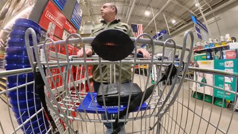 A-shopper-walks-through-lowes-home-improvement-in-March-2022