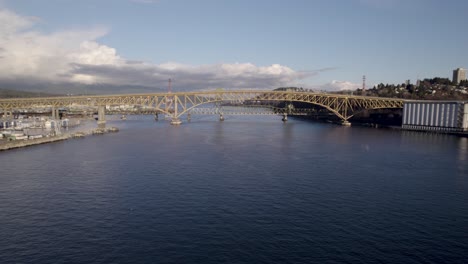 Drone-flying-towards-Ironworkers-Memorial-Bridge,-Vancouver-in-British-Columbia,-Canada
