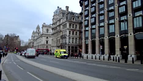 London-Ambulance-vehicle-responding-to-emergency,-siren-and-blue-flashing-lights