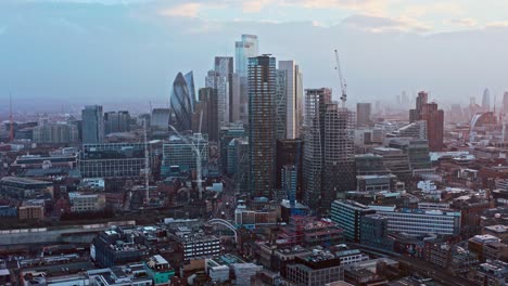 aerial-drone-shot-of-skyscrapers-in-city-of-London-from-shoreditch-highstreet-at-sunset