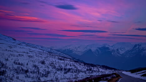 Beautiful-landscape-shot-of-snow-covered-mountains-at-sunset