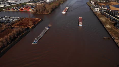Aerial-View-Of-Wilson-Mersey-Cargo-Ship-Navigating-River-Noord-Past-Other-Ships