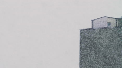 The-top-of-an-estate-tower-during-heavy-snowfalls