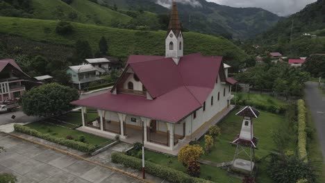 Rising-aerial-of-quaint-Iglesia-de-Prusia-church-in-remote-Peru-valley