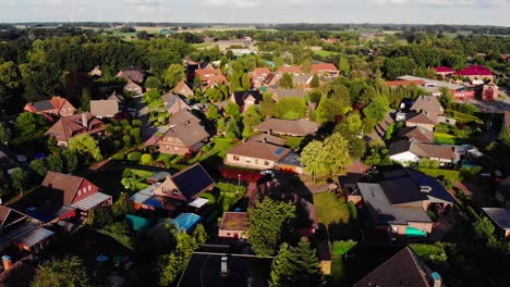 colorful-drone-aerial-flying-ovrer-a-german-village-with-houses-and-pools
