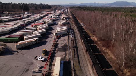 Cargo-train-running-on-railway-along-Vancouver-shipping-terminal-in-Canada